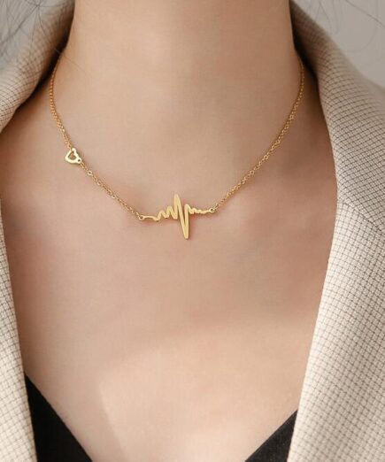 A women wearing Heartbeat necklace made by MinimalistBae